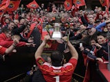 Munster's Marcus Horan carries the trophy following the Magners League Final on May 28, 2011