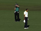 Tiger Woods after his fairway shot on the 15th hole hit the pin and rolled into the water on April 12, 2013