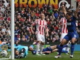 United's Michael Carrick lays on the ground to watch his shot go in against Stoke on April 14, 2013