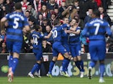 United players congratulate Michael Carrick after a goal against Stoke on April 14, 2013
