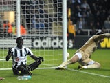 Newcastle striker Papiss Cisse sits dejected after a goal is disallowed against Benfica on April 11, 2013
