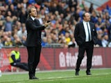 Opposing bosses Roberto Mancini and Rafa Benitez stand on the touchline during the FA Cup semi-final on April 14, 2013