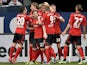 Leverkusen's Simon Rolfes is congratulated by teammates after scoring the opener against Schalke on April 13, 2013