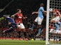 City skipper Vincent Kompany scores an own goal during the Manchester Derby on April 8, 2013