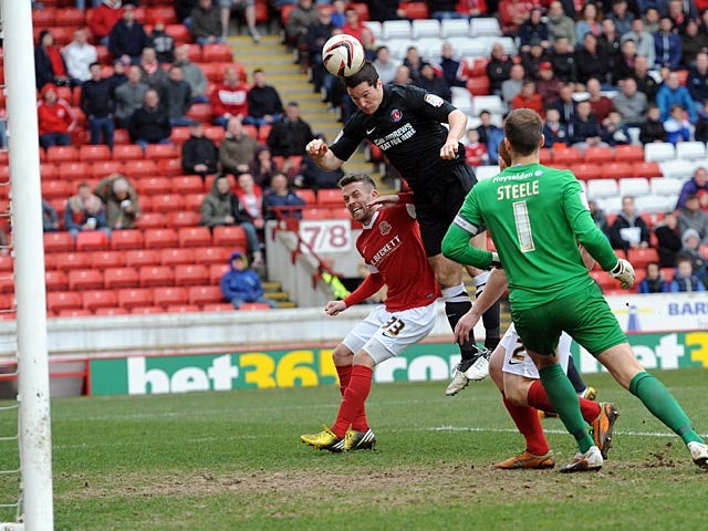 Charlton's Yann Kermorgant heads in his team's third goal in the match against Barnsley on April 13, 2013