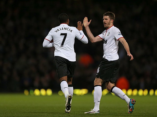 Antonio Valencia celebrates with teammate Michael Carrick after scoring the equaliser against West Ham on April 17, 2013