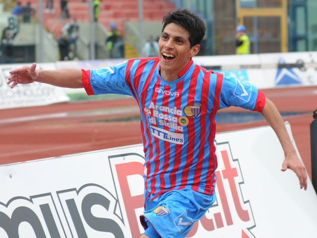Catania midfielder Pablo Barientos celebrates after scoring against Palermo on April 21, 2013