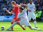 Swansea defender Chico tackles Saints' skipper Adam Lallana on April 20, 2013