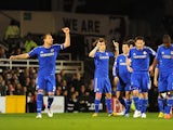 David Luiz celebrates with teammates after scoring the opening goal against Fulham on April 17, 2013