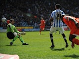 Jermaine Beckford scores for Huddersfield against Millwall on April 20, 2013