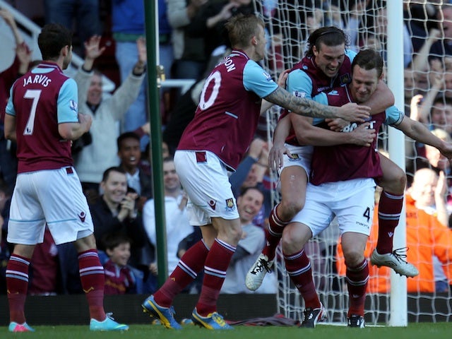 West Ham's Kevin Nolan is congratulated after a goal against Wigan on April 20, 2013
