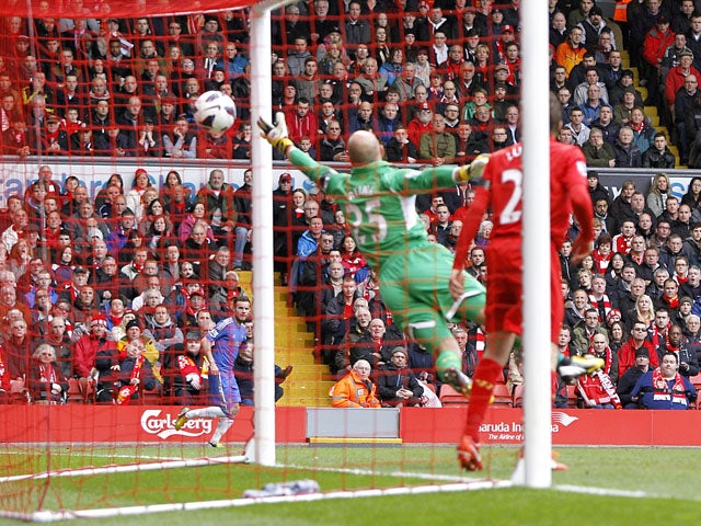 Liverpool's Pepe Reina fails to stop Chelsea's Oscar from scoring the first goal in the Premier League clash on April 21, 2013