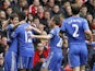 Goalscorer Oscar celebrates with his Chelsea teammates after giving his side the lead in the match against Liverpool on April 21, 2013