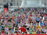 Runners approach the finish line during the London Marathon on April 22, 2012