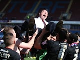 Cardiff manager Malky Mackay is lifted in celebration after his side became champions on April 20, 2013