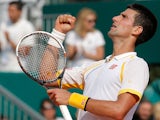 Novak Djokovic punches the air after defeating Mikhail Youzhny during the Monte Carlo Masters on April 17, 2013