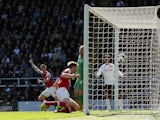 Arsenal defender Per Mertesacker opens the scoring against Fulham on April 20, 2013