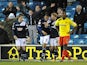 Millwall's Shaun Batt is congratulated by teammates after scoring against Watford on April 16, 2013