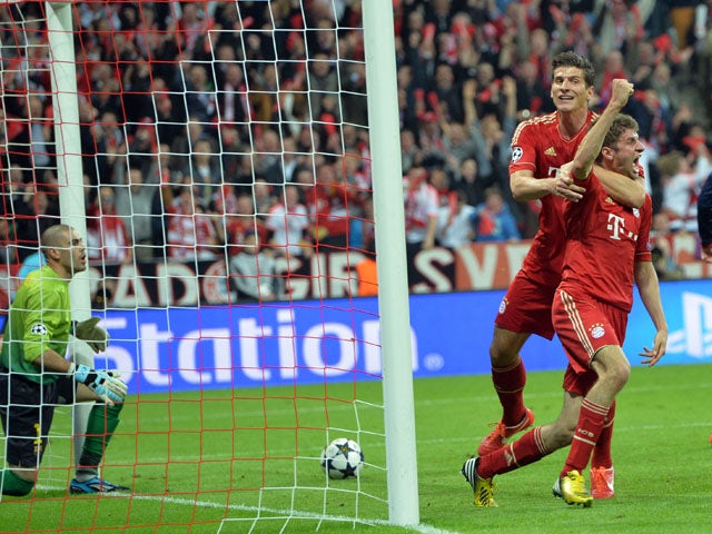 Bayern's Thomas Muller celebrates scoring against FC Barcelona during the Champions League semi final first leg on April 23, 2013