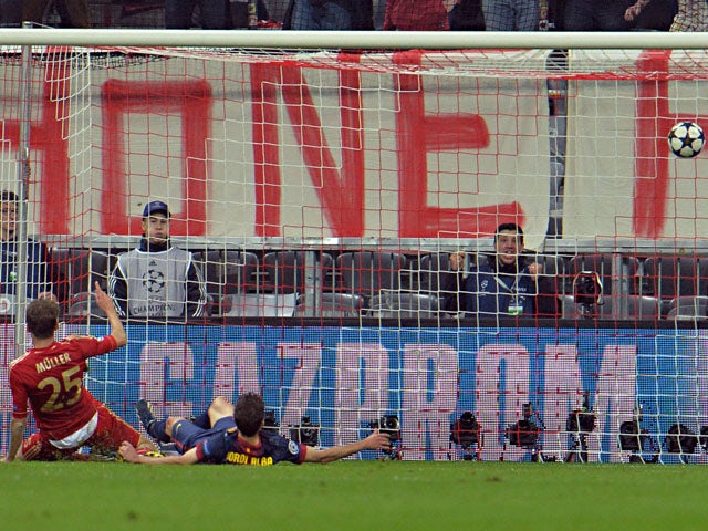 Bayern's Thomas Muller scores his second goal against FC Barcelona during the Champions League semi final first leg on April 23, 2013