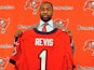 NFL cornerback Darrelle Revis holds up a Tampa Bay Buccaneers jersey during his unveiling to the press on April 22, 2013