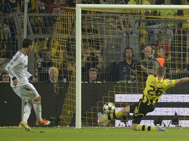 Real Madrid's Cristiano Ronaldo scores during the Champions League semi final match against Borussia Dortmund on April 24, 2013