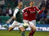 Hibernian's Leigh Griffiths holds off Aberdeen's Ryan Jack during the Scottish Premier League match on April 22, 2013