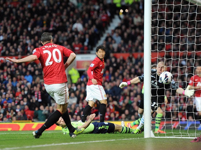 Manchester United's Robin van Persie scores his first goal against Aston Villa on April 22, 2013