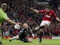 Manchester United's Robin van Persie scores his third goal against Aston Villa on April 22, 2013