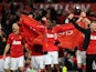 Manchester United players celebrate winning the Premier League title on April 22, 2013
