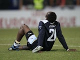 Lazio's Modibo Diakite sit on the pitch during the Europa League match against FC Vaslui on December 1, 2011