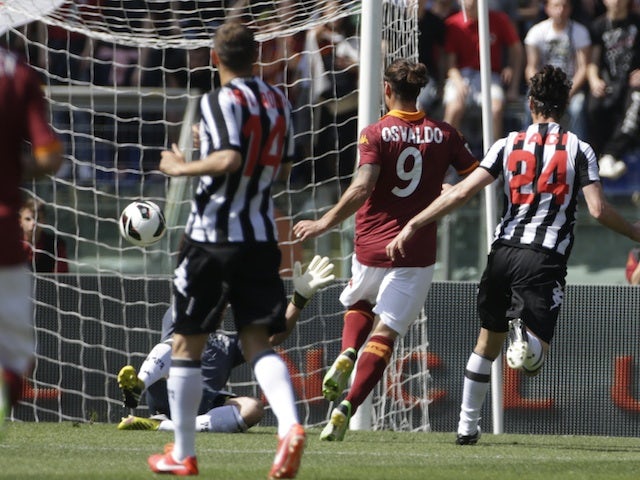 Roma's Pablo Osvaldo scores against Siena on April 28, 2013