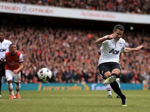 Van Persie earns United draw at Arsenal