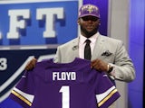 Minnesota Vikings first round draft pick Sharrif Floyd holds up his new jersey on April 25, 2013
