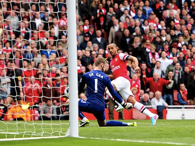 Arsenal's Theo Walcott gives his team an early lead against Man Utd on April 28, 2013