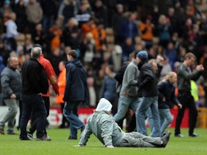 Police probe Wolves pitch invasion