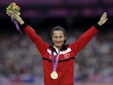 Turkish runner Asli Cakir Alptekin celebrates her gold medal win in the Ladies 1500m at London 2012