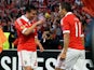 Benfica's Nicolas Gaitan celebrates with a teammate after scoring against Fenerbahce on May 2, 2013