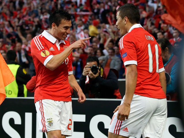 Benfica's Nicolas Gaitan celebrates with a teammate after scoring against Fenerbahce on May 2, 2013