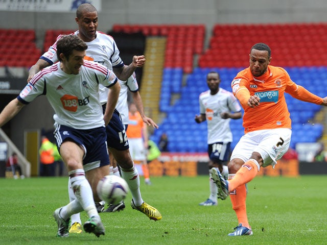 Blackpool's Matt Phillips scores the first goal against Bolton Wanderers on May 4, 2013