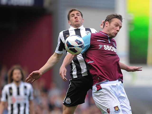 Dan Gosling and Kevin Nolan battle for the ball on May 4, 2013