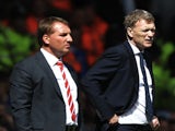 Rival bosses David Moyes and Brendan Rodgers standing on the touchline on May 5, 2013