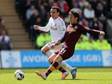 David Silva and Leon Britton battle for the ball on May 4, 2013