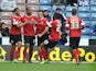 Barnsley's Chris O'Grady is congratulated after scoring against Huddersfield Town on May 4, 2013