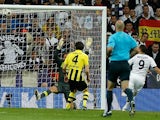 Real's Karim Benzema scores his team's first goal against Dortmund on April 30, 2013