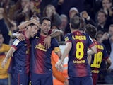 Barca's Leo Messi is congratulated after a goal against Real Betis on May 5, 2013