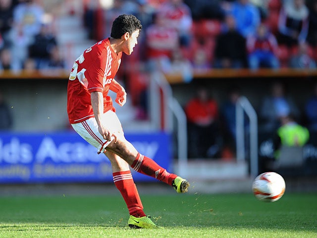 Swindon's Massimo Luongo scores the opening goal against Brentford on May 4, 2013