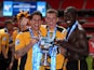 Newport County players celebrate their Blue Square Premier League victory over Wrexham on May 5, 2013
