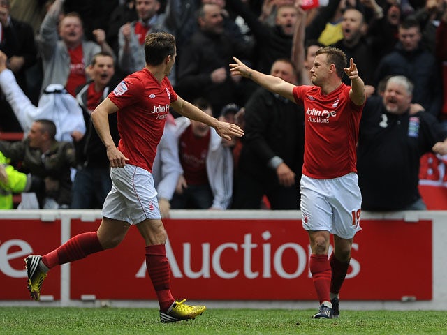 Nottingham Forest's Simon Cox celebrates scoring against Leicester City on May 4, 2013