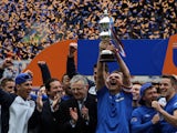 Rangers' Lee McCulloch holds up the league trophy on May 4, 2013